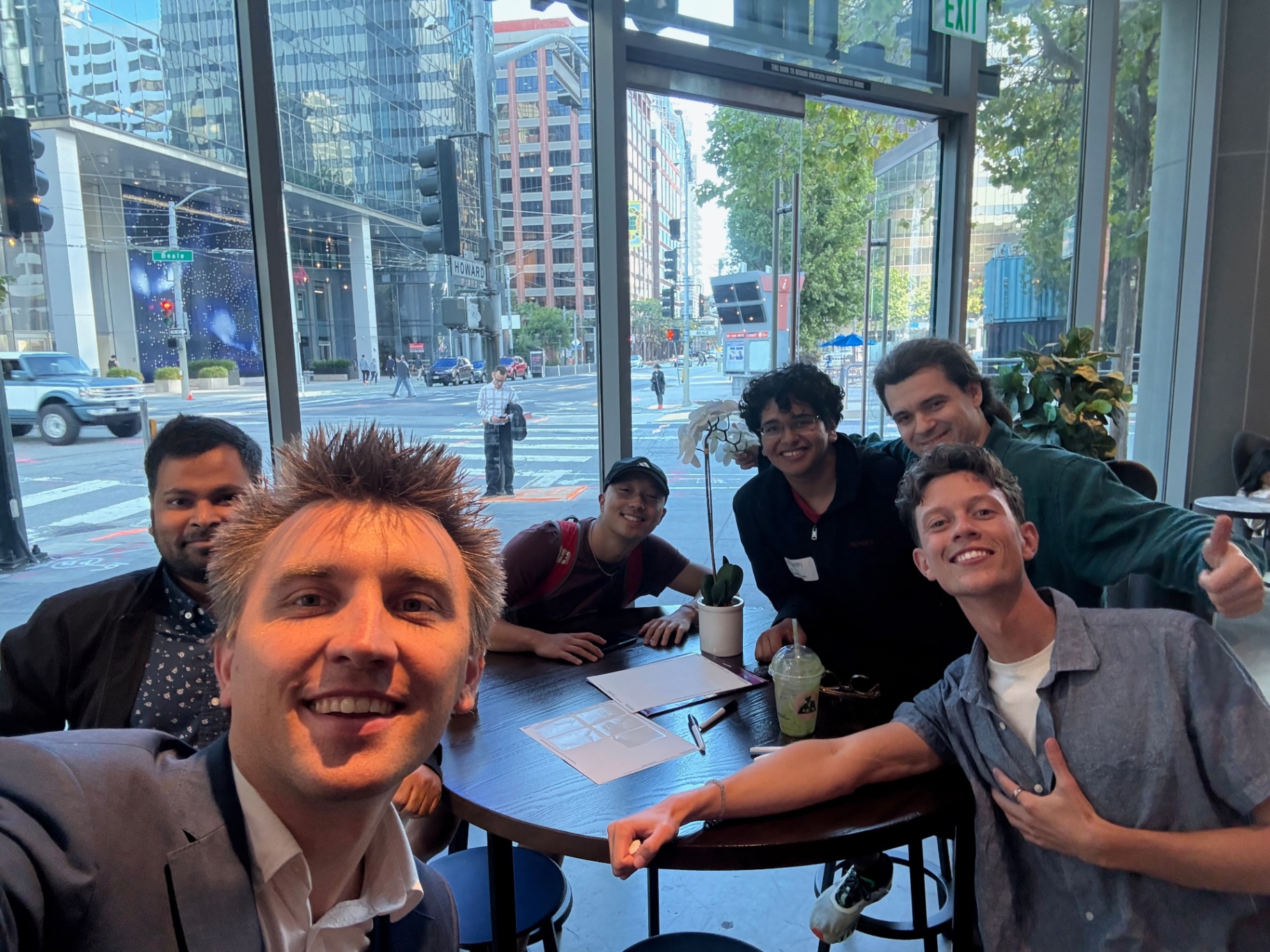 Small founders meetup selfie near the front windows