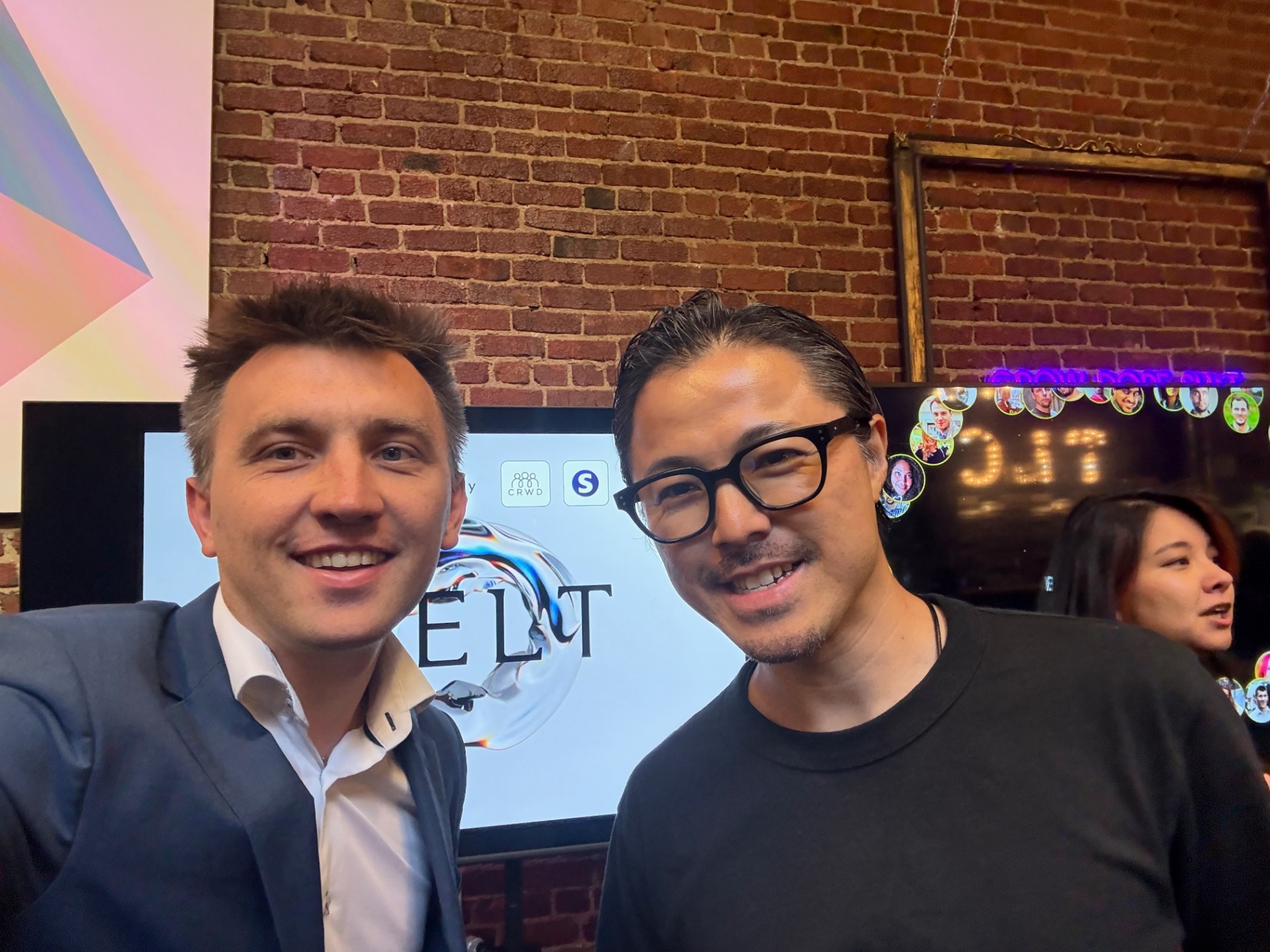 Host and founder smiling together at an evening SF event