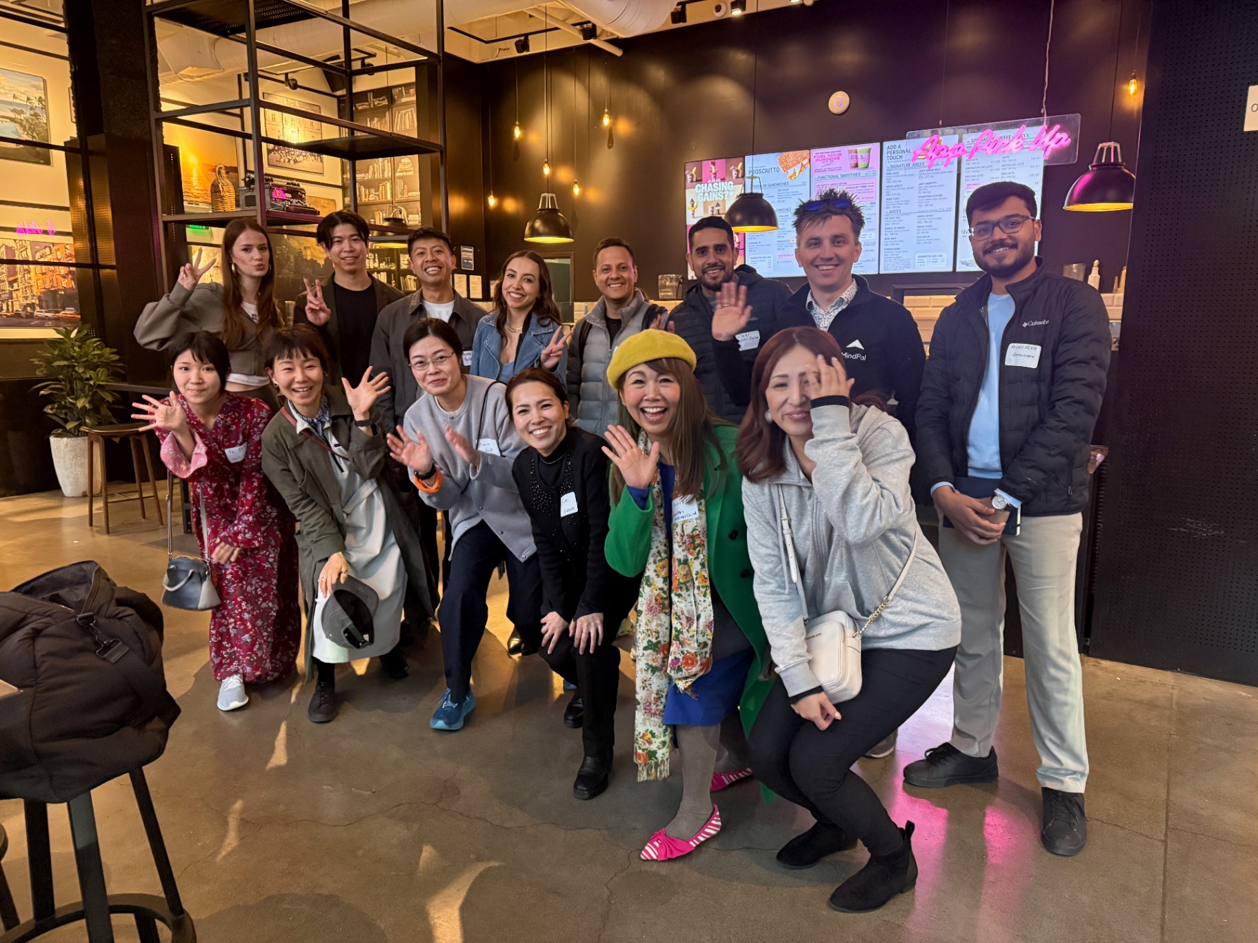 Group of founders waving at the camera