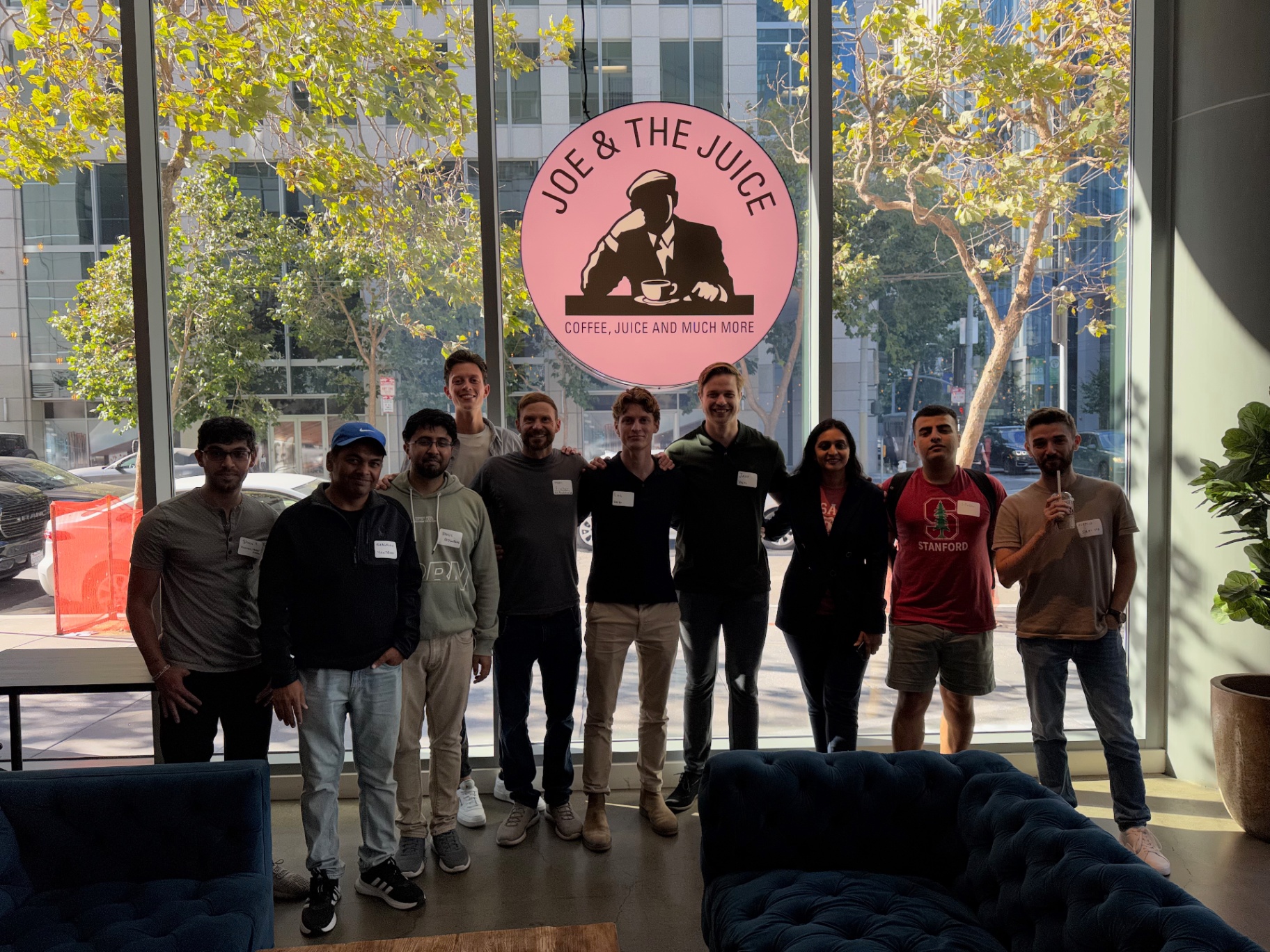 Founders lined up in front of the venue window in daylight