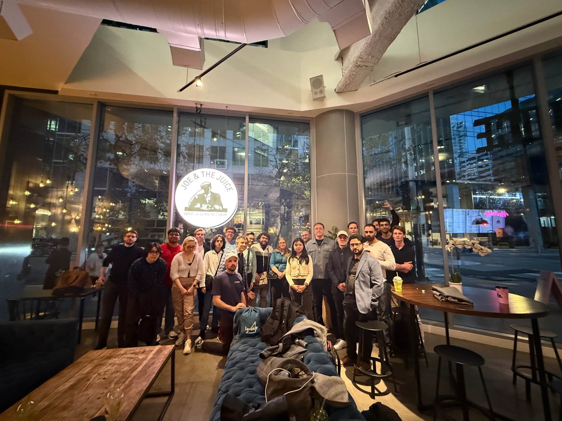 Wide group photo of founders in the lounge area